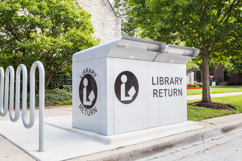 Metal box labelled library return outside the library building