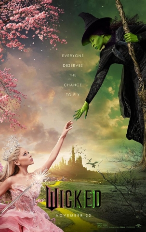 Wicked movie poster with green-skinned Elphaba dressed in black holding a broom reaching down to Galinda, wearing a pink gown.