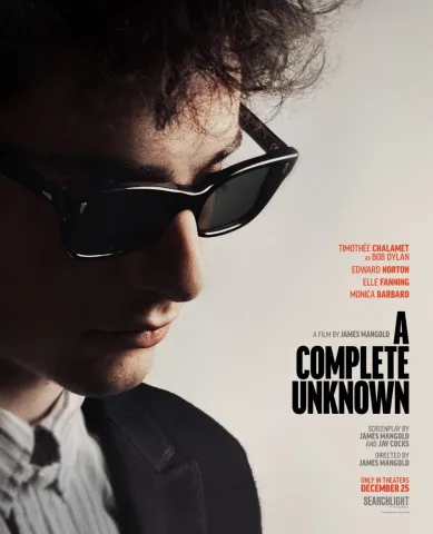 A Complete Unknown movie poster with Timothée Chalamet as Bob Dylan wearing sunglasses and looking down