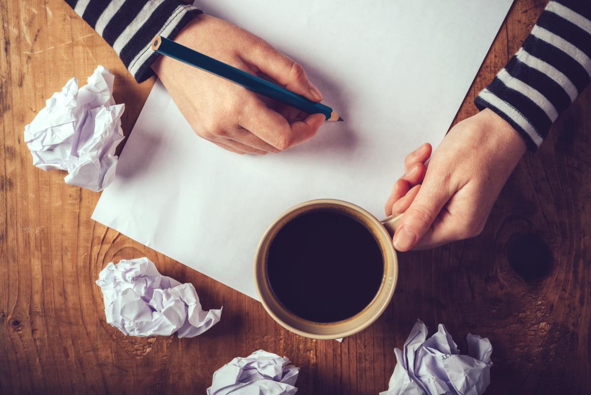 Writer with cup of coffee